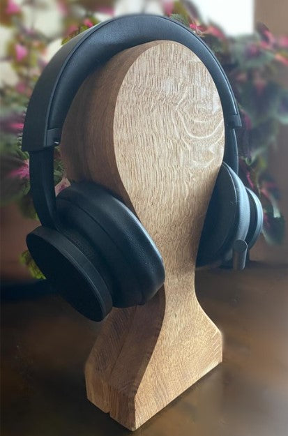 Headphones on an oak headphone stand  
